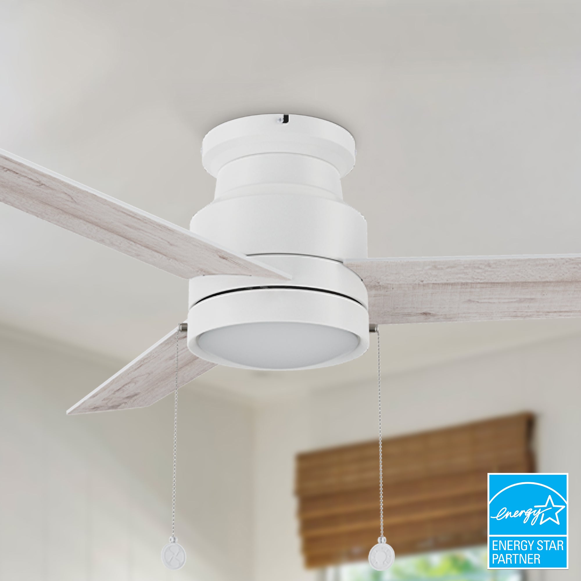 52-inch white flush mounting ceiling fan with dimmable LED light and pull chain. 