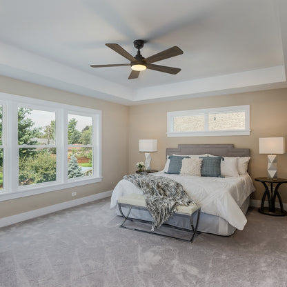 Smafan Toplam 52 inch wood ceiling fan with bright light in a traditional bedroom featuring a large bed with white linens, a white bench, matching nightstands with lamps, and large windows overlooking greenery. 