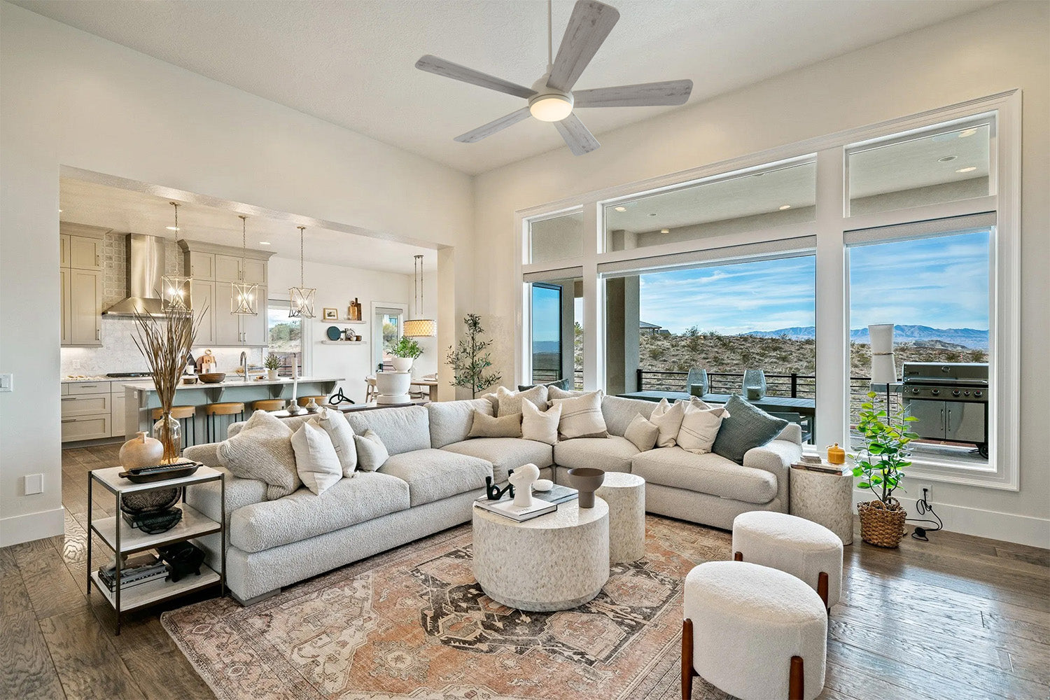 Smafan Toplam 52 inch white and light wood grain ceiling fan with light installed in a modern farmhouse living room with high ceiling.