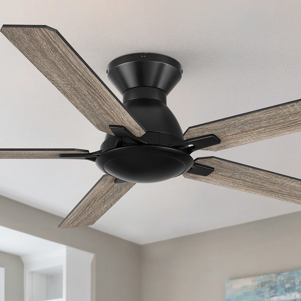 A matte black, low-profile ceiling fan with five gray wood-grain blades. 