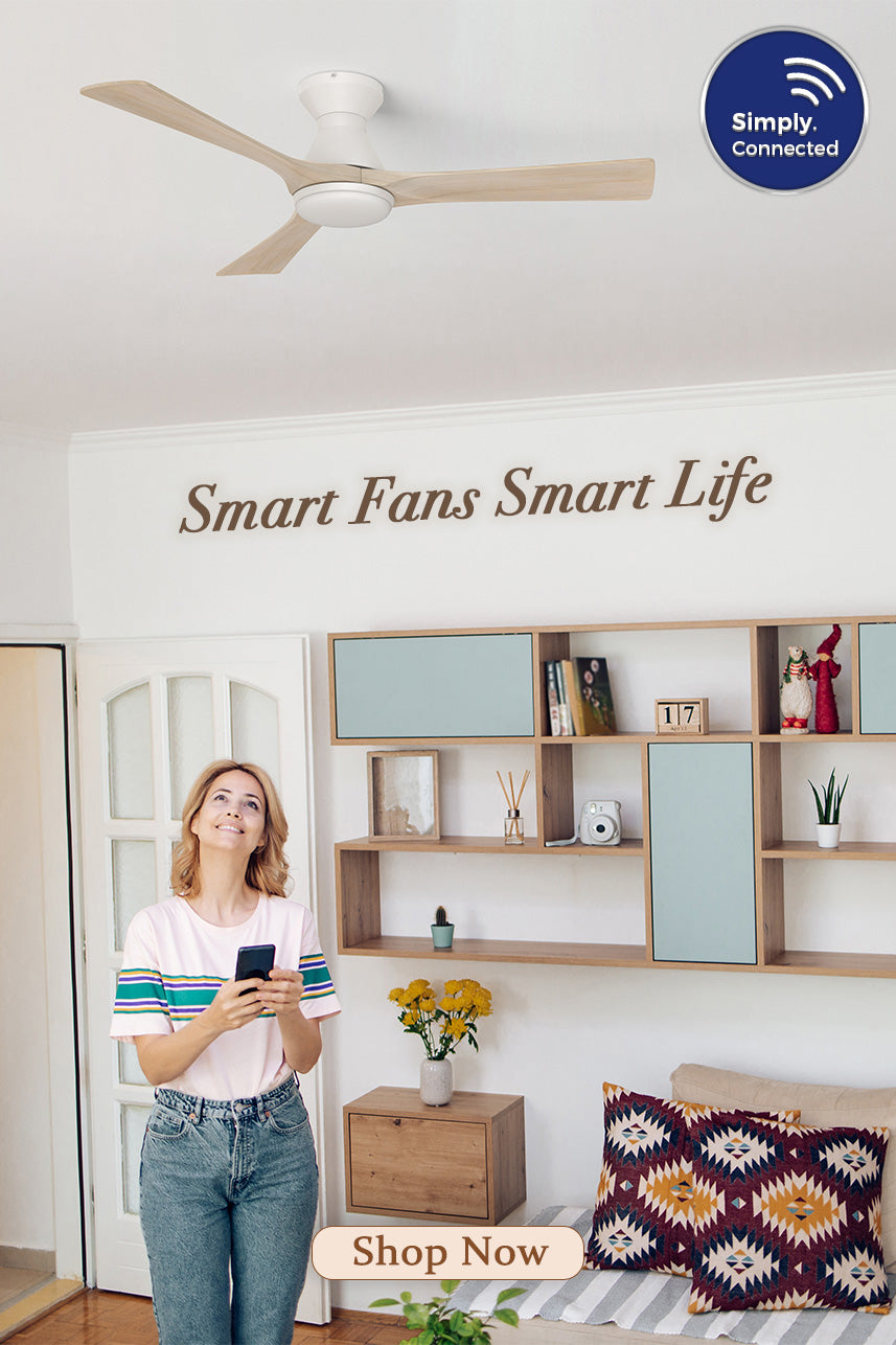 Woman using a smartphone to control a Smafan smart ceiling fan with light in a modern living room. The white three-blade smart ceiling fan features Wi-Fi connectivity and app control, highlighting convenient smart home integration and hands-free comfort.