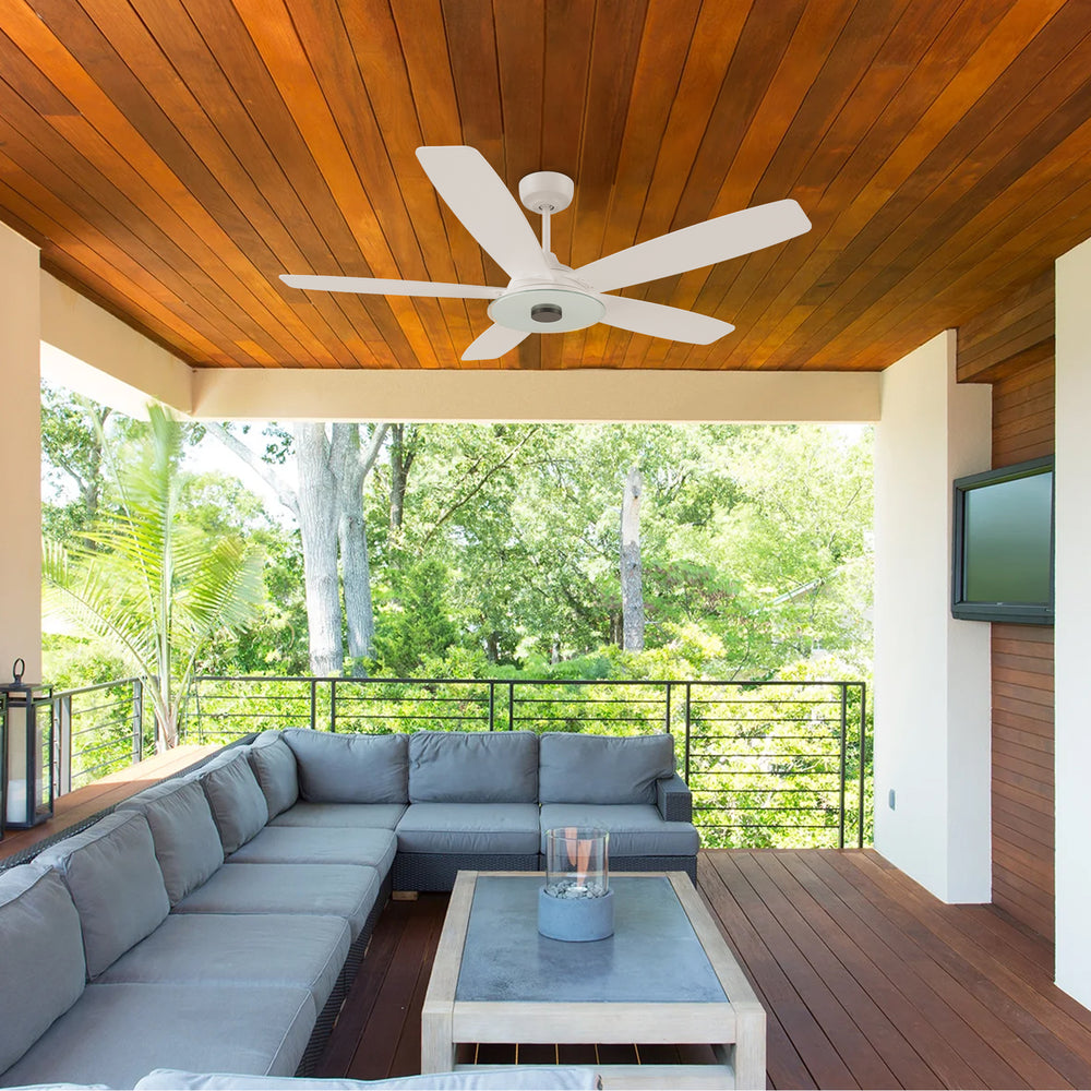 A covered outdoor patio featuring a Striker 52-inch White Outdoor Ceiling Fan with light, mounted on a wooden ceiling for efficient airflow and cooling. The smart ceiling fan has white blades, complementing the patio&