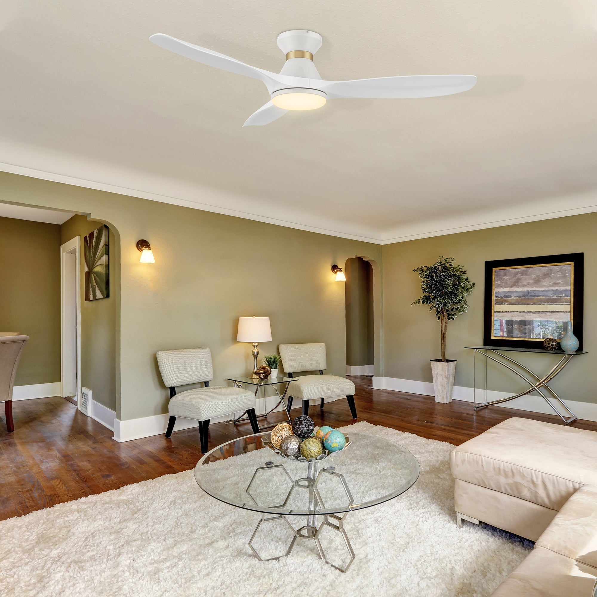 The Kore 52" white flush mount smart ceiling fan keeps your space cool, bright, and stylish. This soft modern masterpiece is perfect for large indoor living spaces. The fan boasts a simple design with White finish, very strong ABS blades and an integrated 4000K LED cool light. Additionally, the fan features Remote control, Wi-Fi apps, Siri Shortcut and Voice control technology (compatible with Amazon Alexa and Google Home Assistant ) to easily set your fan preferences. 