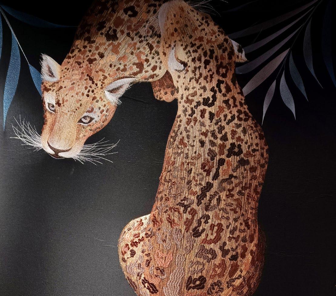 An embroidery artwork about two leopards' bodies detail 