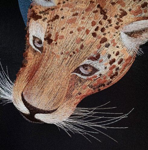 Embroidered artwork details for leopard head
