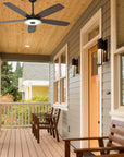 Carro Striker 56 inch outdoor ceiling fan with 5 dark wood fan blades design, installed in outdoor patio. 