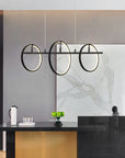 Smafan Abbey Modern Creative LED Chandelier Pendant Light,this black 3 light LED hanginig light with geometric integrated into the design,using simple circles to outline the most spiritual space,everywhere has a simple and extraordinary fashion sense.It is a good decor to your house by this circle pendant light fixture.It comes with two different sizes of circles to make a simple and modern style,at the same time,without lack of aesthetics.