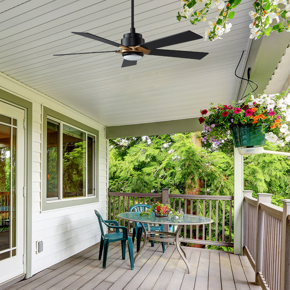 Aspen Outdoor smart fans with light, installed in the covered home garden with 5 black and gold fan blades. 