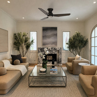 Smafan Brooks 48 inch flush mount ceiling fan with LED light in matte black, installed in a modern living room. The three-blade ceiling fan complements the neutral interior with a marble fireplace, contemporary furniture, indoor trees, and a minimalist design, providing stylish and efficient airflow for medium-sized living spaces. #color_wood