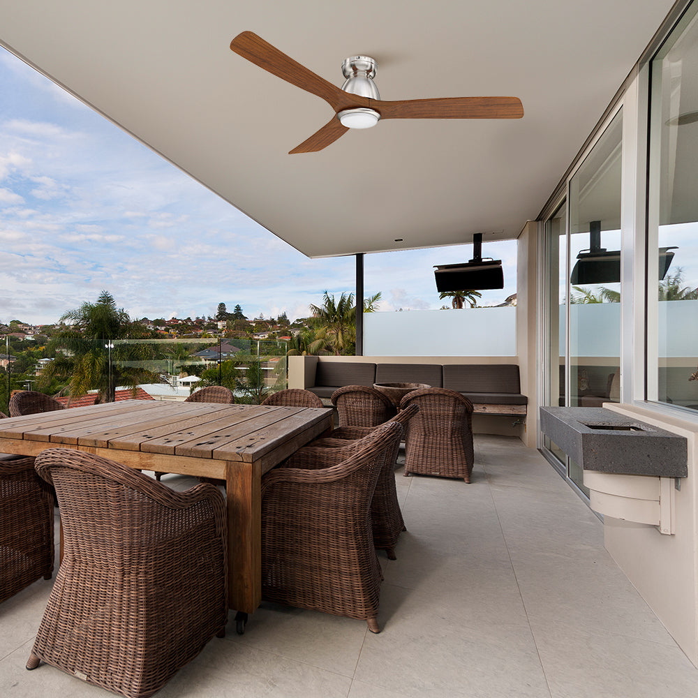 Carro Oswego 52 inch outdoor ceiling fan with LED light, and 3 solid wood fan blades, flush mounted in covered patio. 