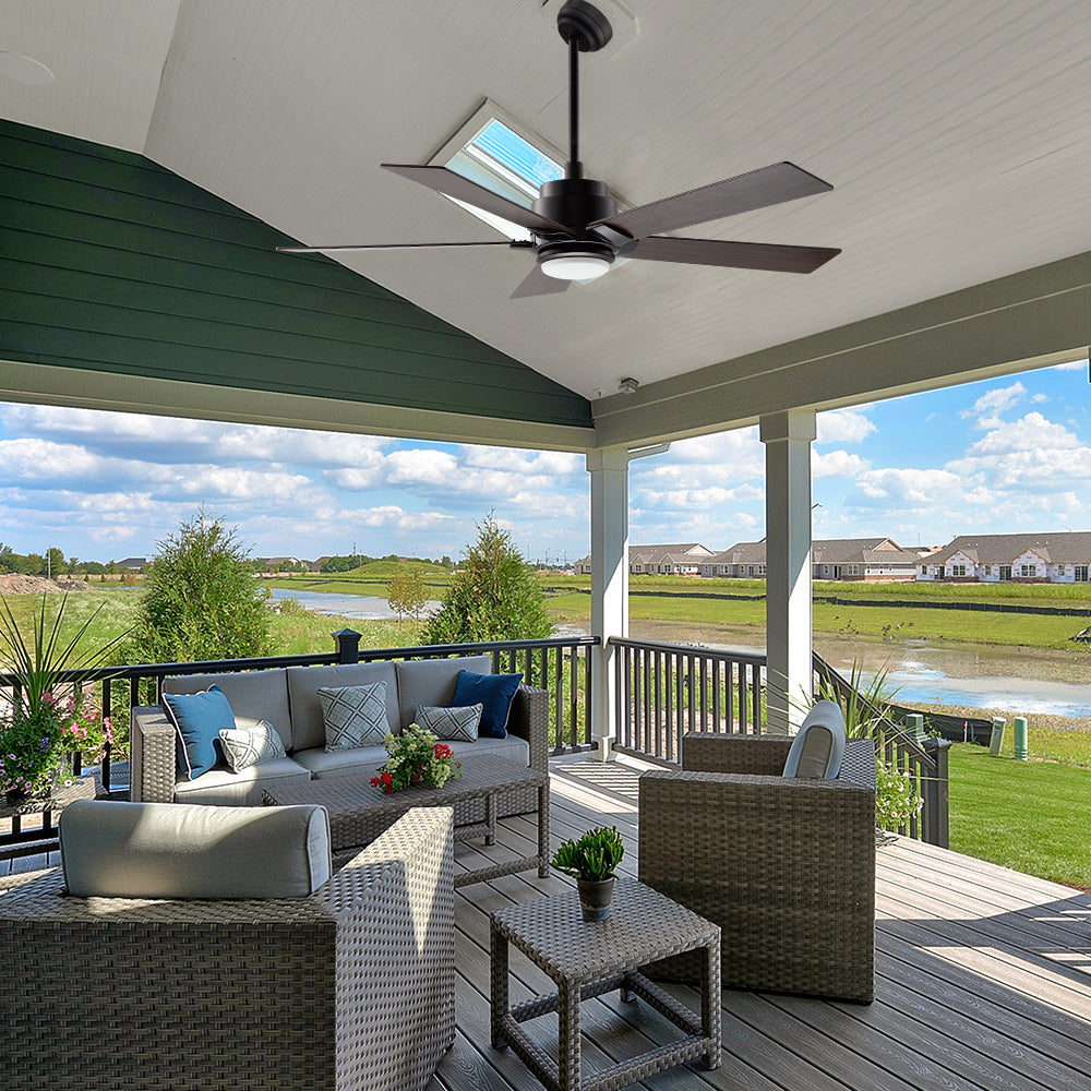 Outdoor ceiling fan ASPEN with 5 blades, in modern design, mounted on a slanted patio roof with an extended rod. 