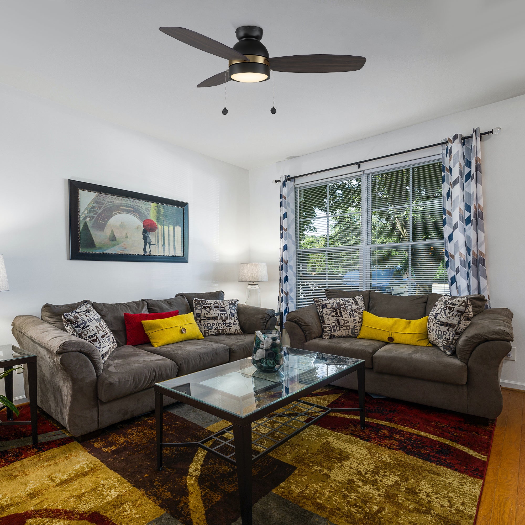 Smafan Carro Troyes 48 inch pull-chain ceiling fan design with dark wood Plywood blades and integrated 4000K LED light, downrod mounted in livingroom. 