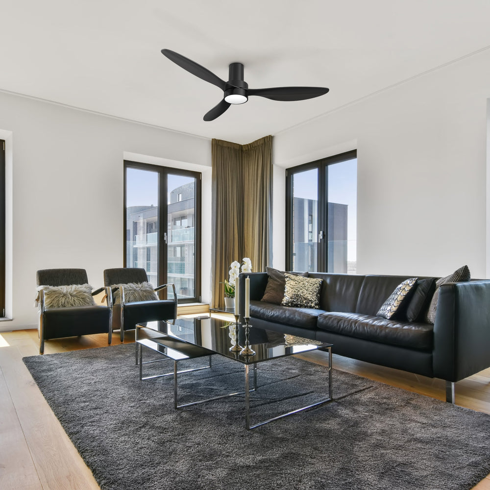 A 52-inch Smafan Coleman flush-mount ceiling fan in black, featuring Wi-Fi and Alexa voice command compatibility, mounted on a white ceiling in modern living room. 