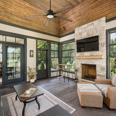 Smafan modern rustic 5-blade outdoor ceiling fan with downrod and light kit installed in an enclosed rustic porch featuring wood plank ceilings, stone fireplace, and wicker lounge seating. #color_wood